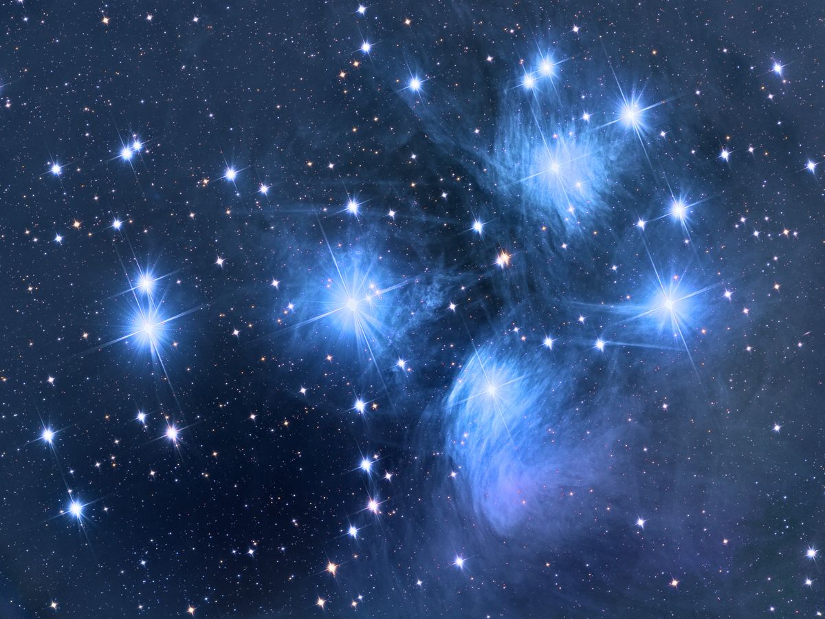 The Pleiades star cluster in a dark night sky