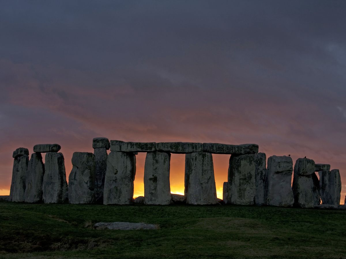 Sunrise through the stones of Stonehenge
